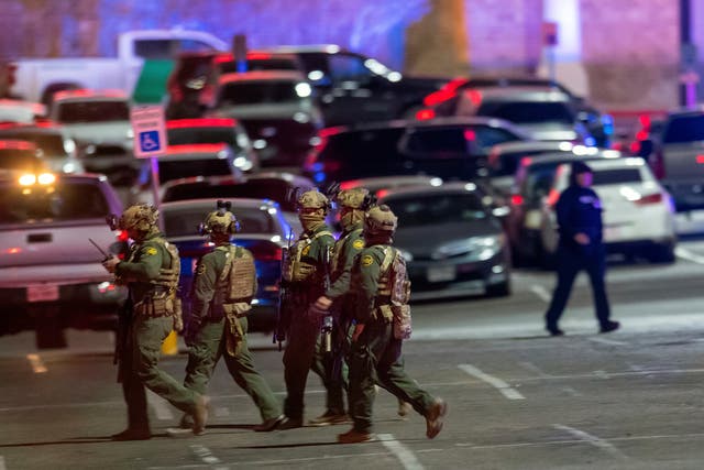 <p>File: Law enforcement agents walk in the parking lot of a shopping mall, Wednesday, Feb. 15, 2023, in El Paso, Texas</p>