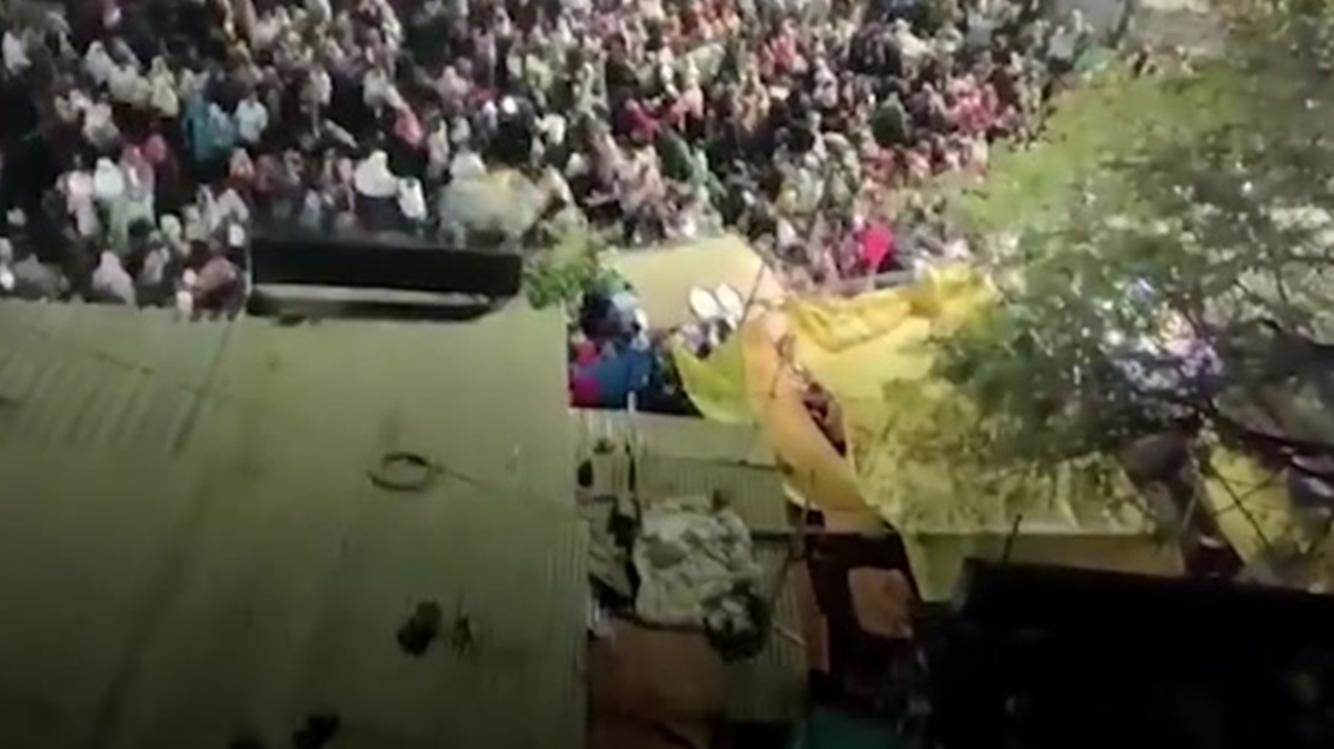 Moment rampaging bull charges into packed crowd during religious festival