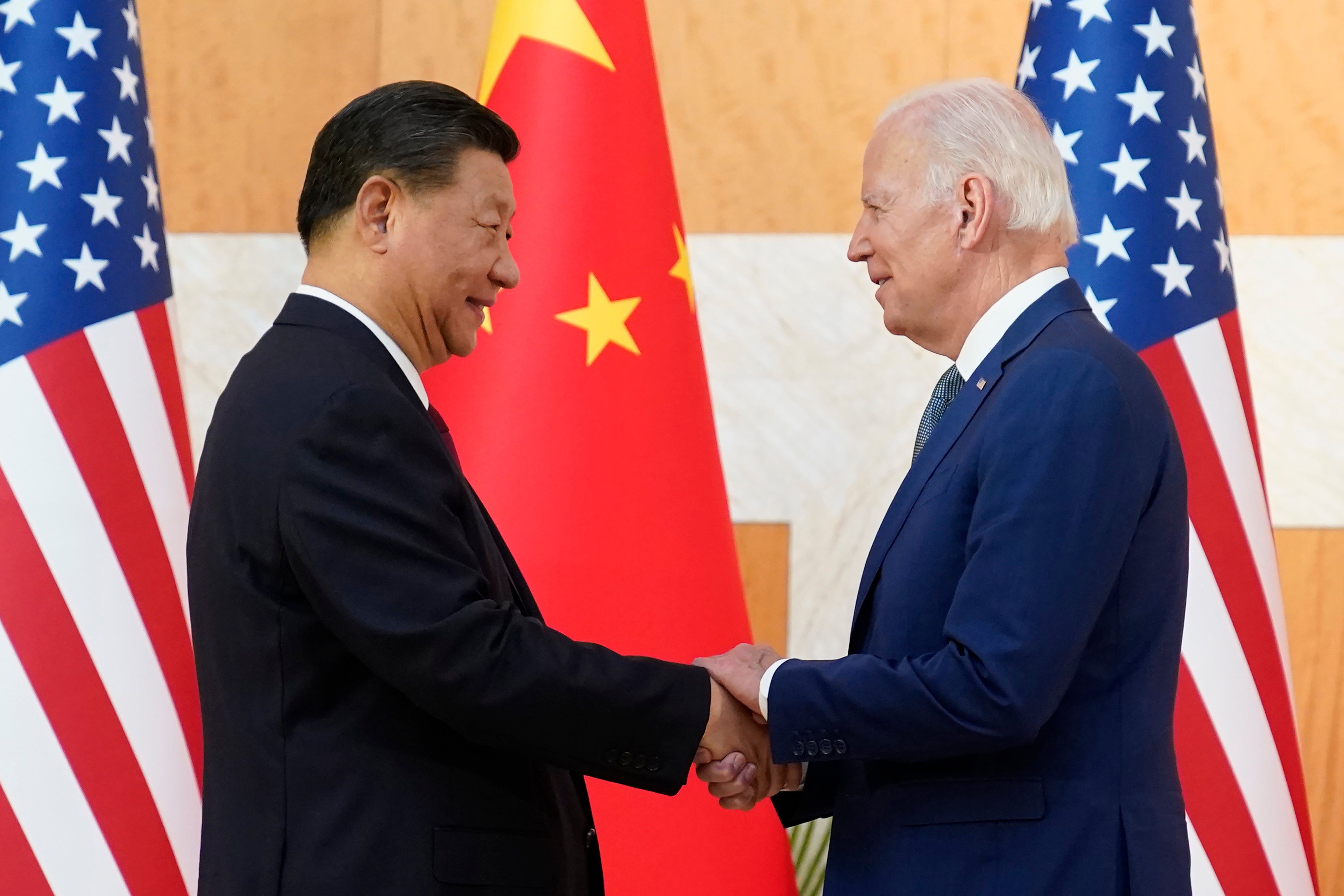 Biden and Xi shake hands in November 2022 during a G20 summit in Bali