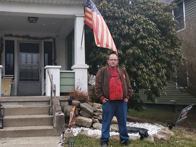 <p>Eric Cozza stands outside his East Palestine home, less than a half a mile from where a Norfolk Southern train derailed</p>