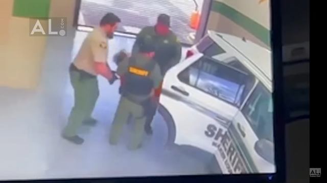 <p> Screengrab from a video shows Walker County Jail officers taking Anthony Mitchell to hosital in unconcious state </p>