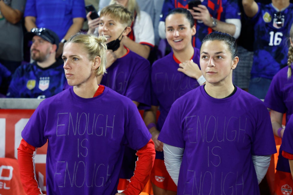 Canada’s Sophie Schmidt and Sabrina D'Angelo with the purple ‘Enough is Enough’ jerseys