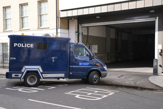 An armoured police van believed to be carrying David Smith enters Westminster Magistrates’ Court in April 2022 (Jonathan Brady/PA)