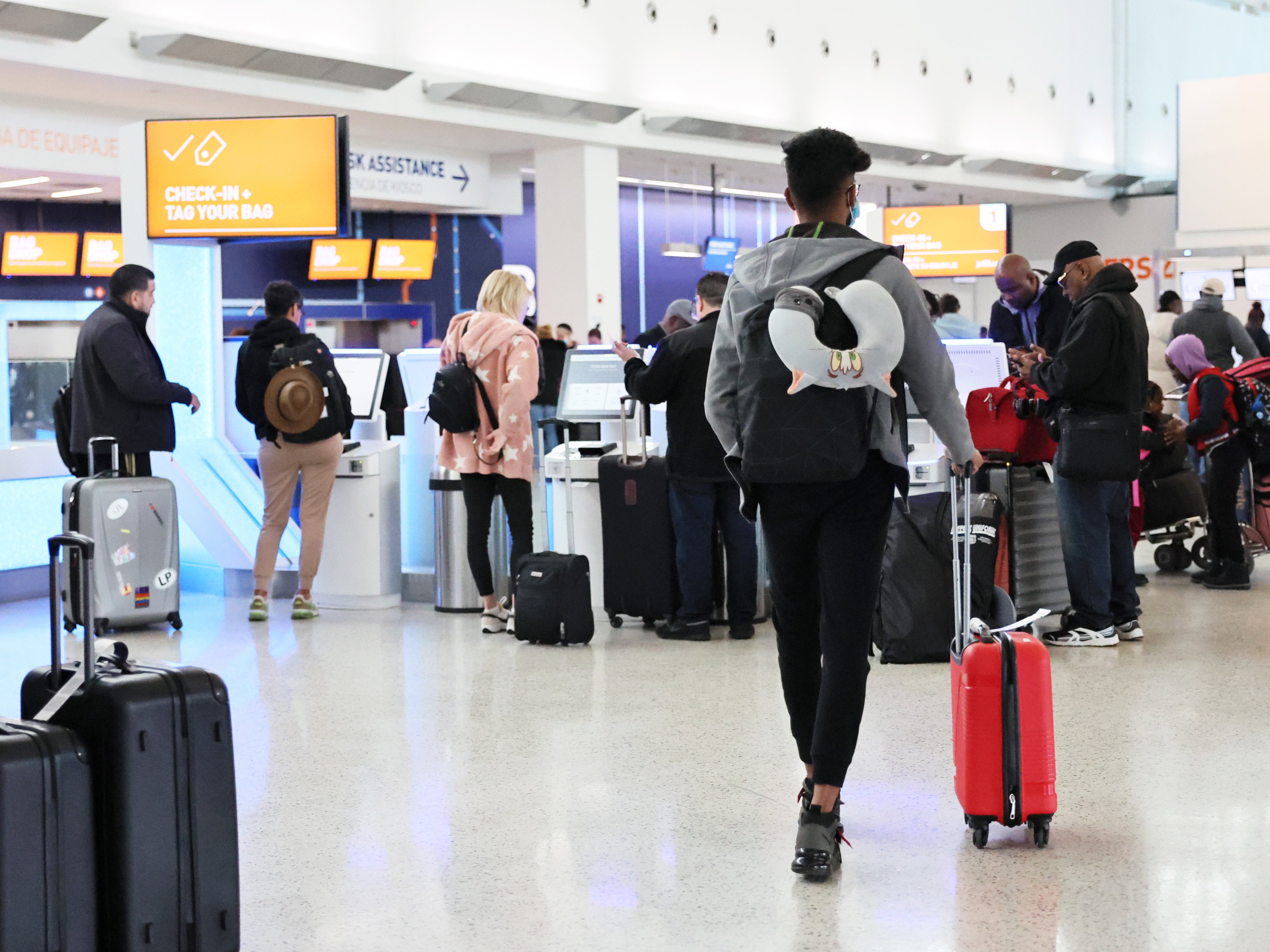 <p>People check-in for their flight at JFK airport on January 11, 2023 in New York City</p>