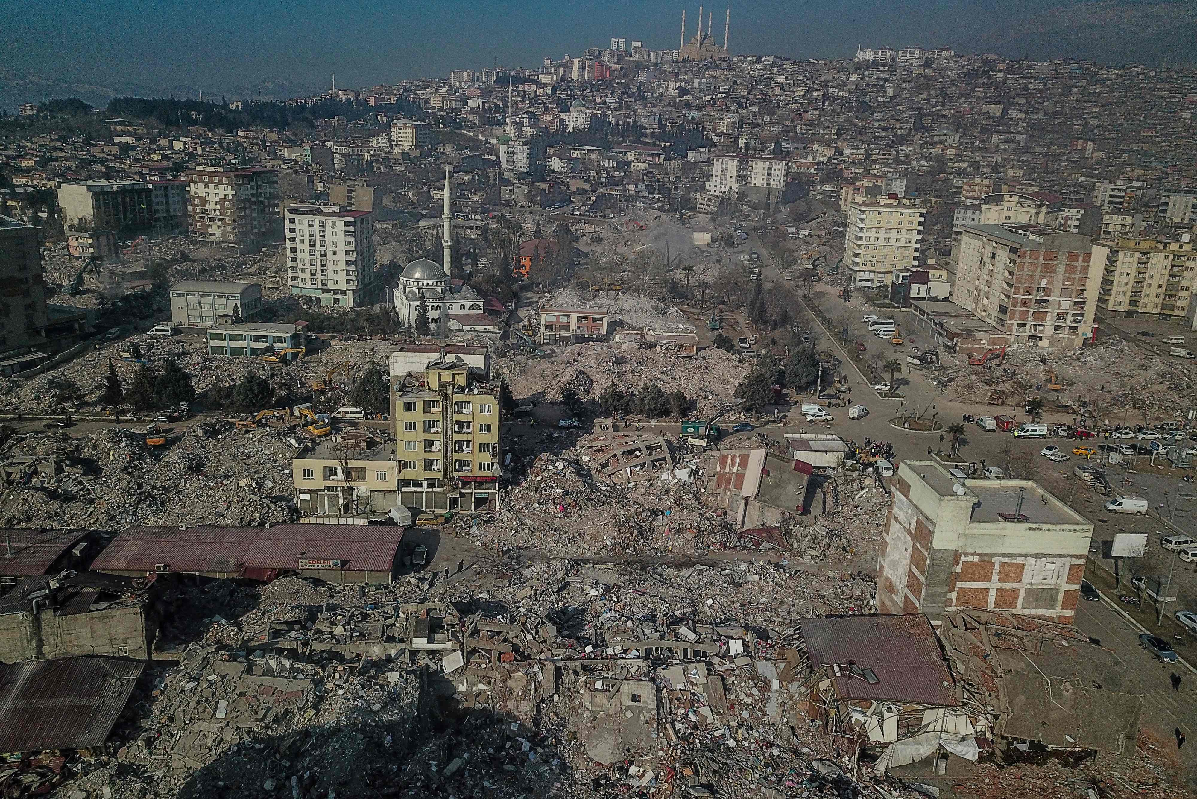 This aerial view shows collapsed buildings during ongoing rescue operations in Kahramanmaras