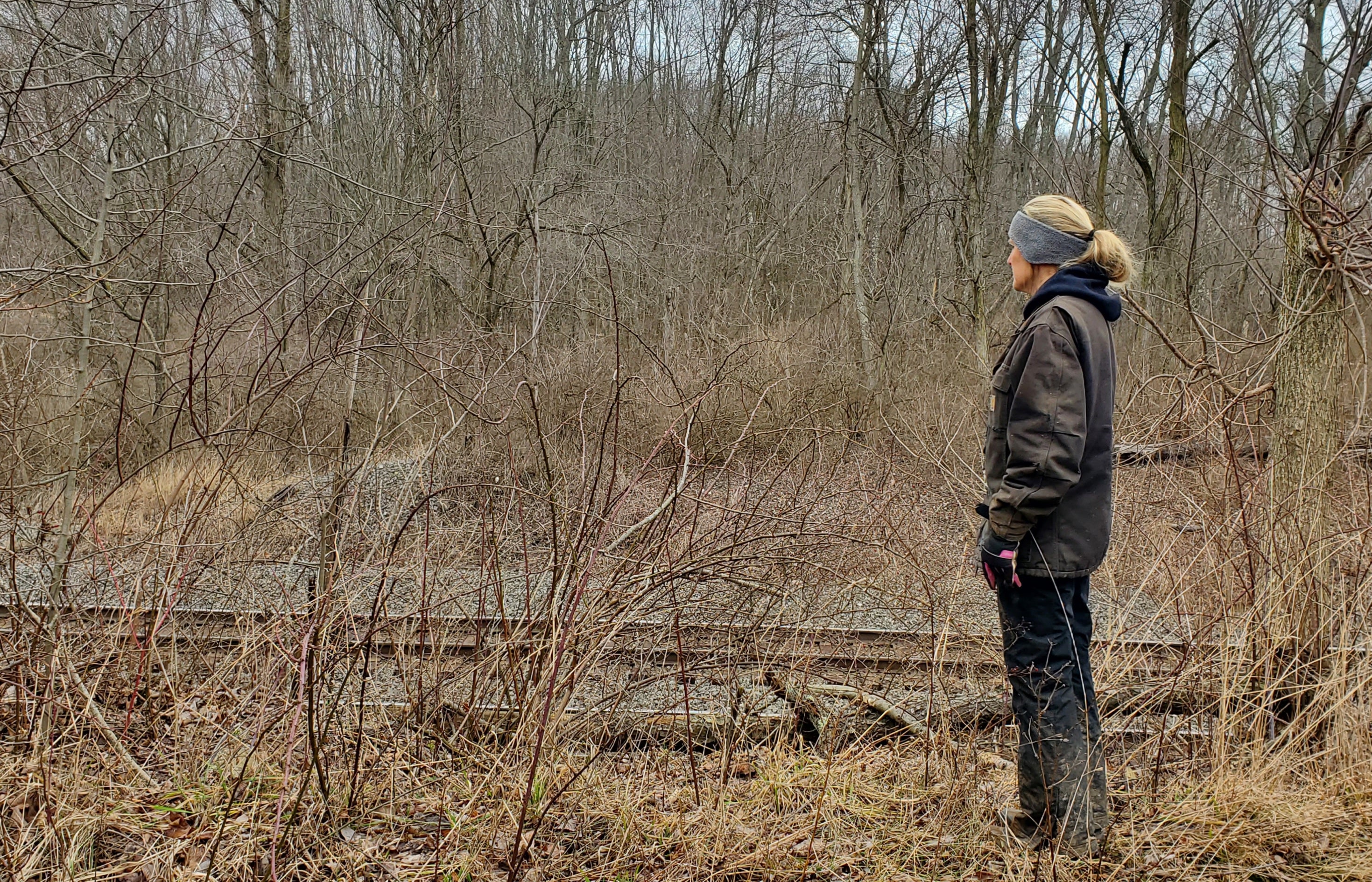 Sonia Early, owner of the Early Equine Centre near East Palestine, Ohio, examines the Norfolk Southern tracks behind her property