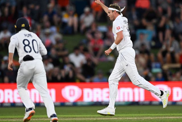 Stuart Broad, right, celebrates the wicket of New Zealand’s Devon Conway (Andrew Cornaga/Photosport via AP)