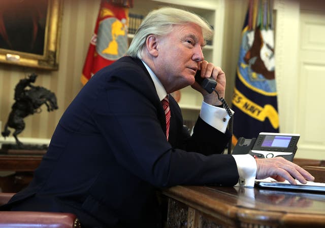 <p>U.S. President Donald Trump speaks on the phone with Irish Prime Minister Leo Varadkar on the phone in the Oval Office of the White House June 27, 2017 in Washington, DC.</p>