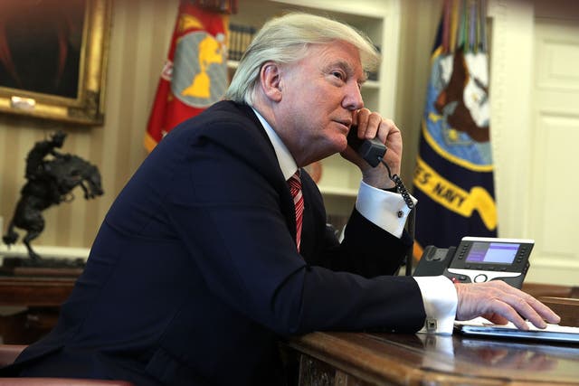 <p>U.S. President Donald Trump speaks on the phone with Irish Prime Minister Leo Varadkar on the phone in the Oval Office of the White House June 27, 2017 in Washington, DC.</p>