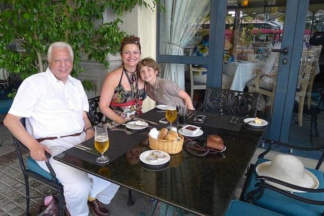 <p>John Simpson with his wife Dee Kruger and son Rafe </p>