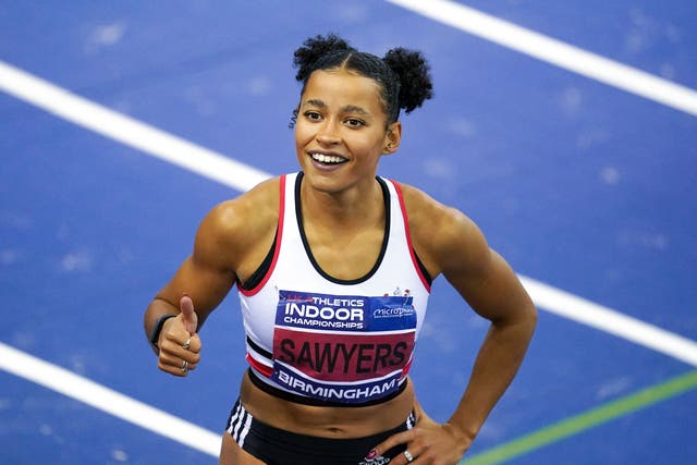 Jazmin Sawyers celebrates victory in the long jump (Martin Rickett/PA).