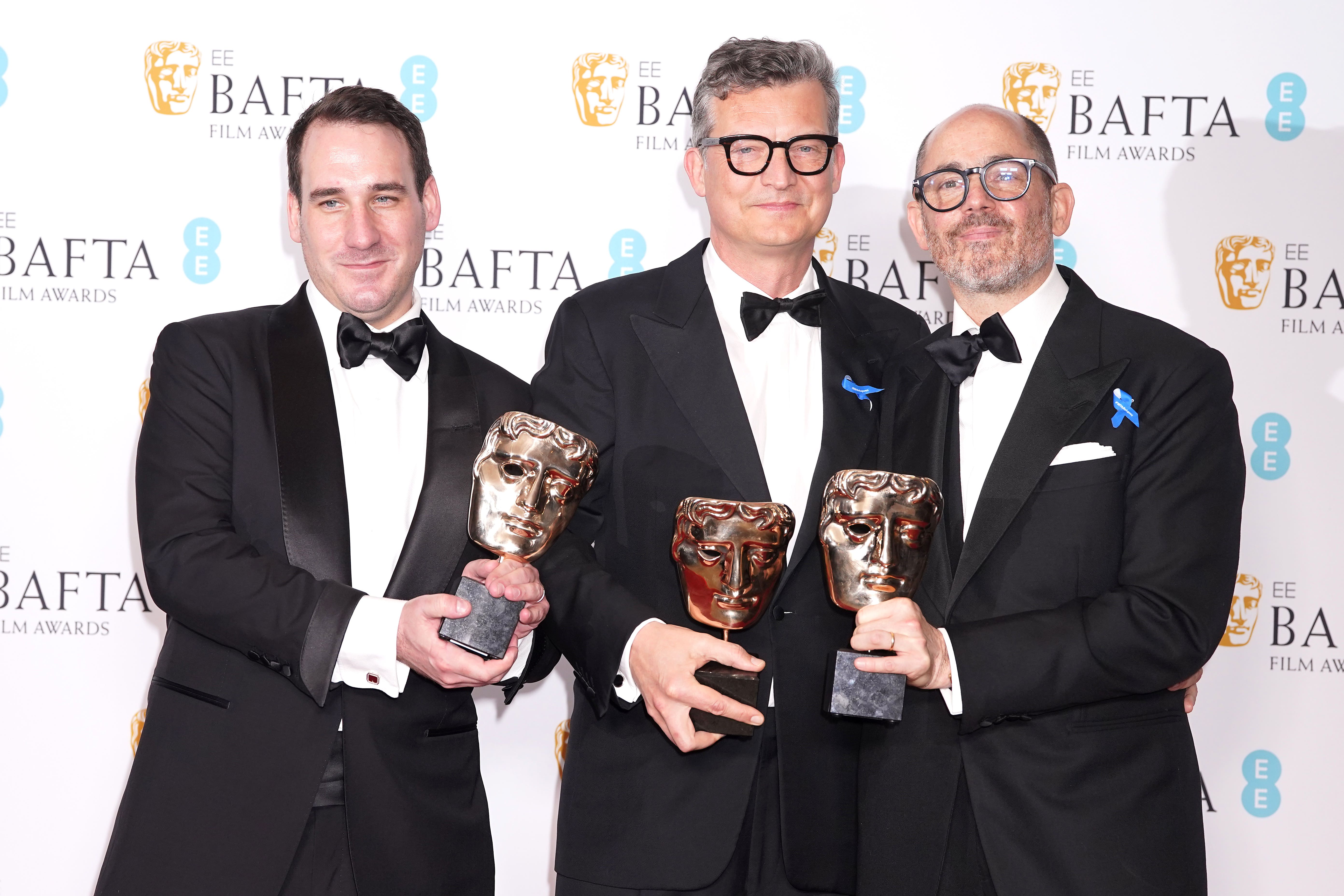 From left, James Friend, Malte Grunert and Edward Berger wotj their Baftas for All Quiet on the Western Front (Ian West/PA)