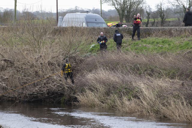 A police diving team at the River Wyre near St Michael’s on Wyre (Jason Roberts/PA)