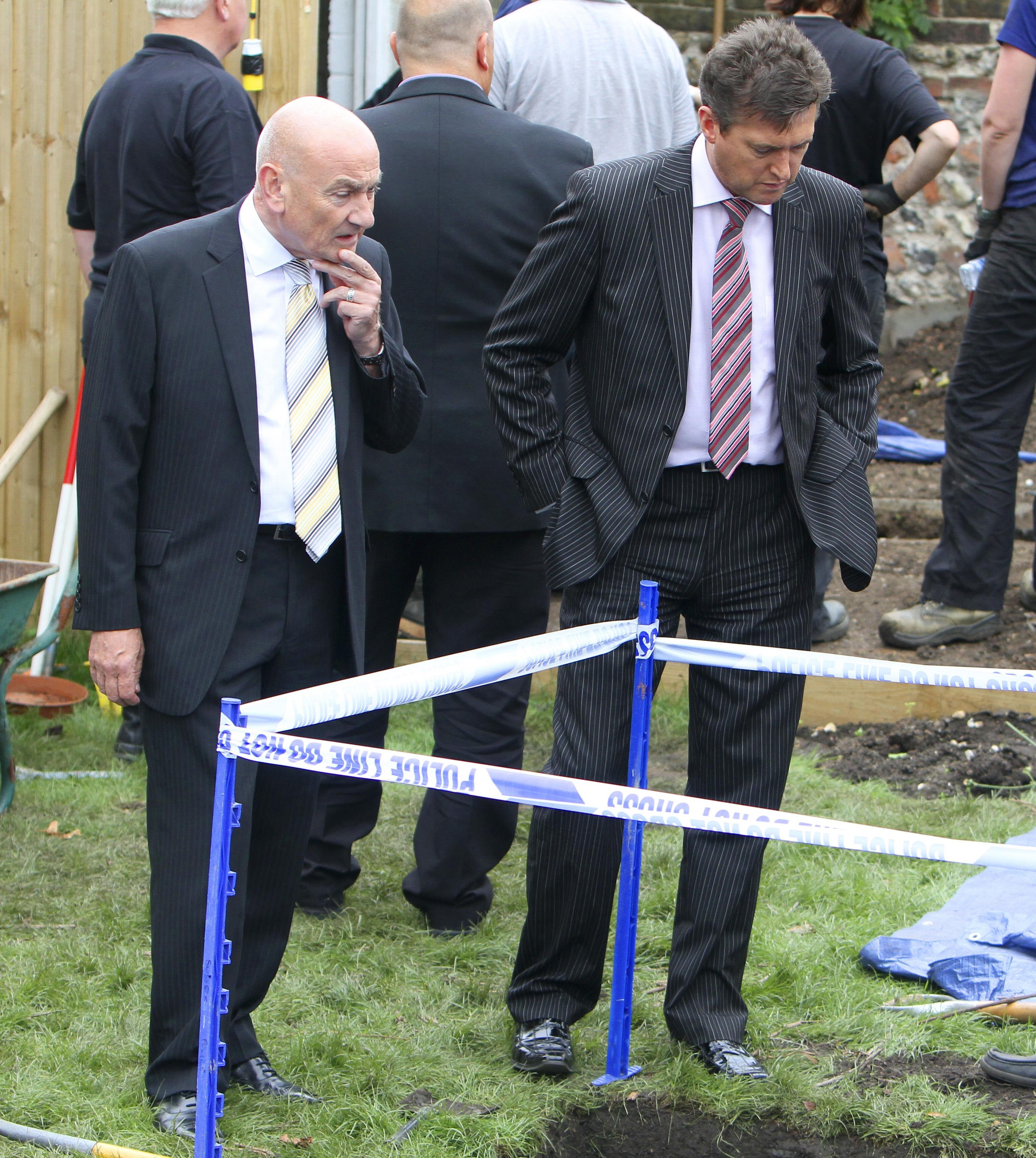 David Swindle and Detective Sergeant Graham MacKellar (right) of Strathclyde Police join specialist officers from Sussex Police as they continue to search the garden of a house in Station Road, Portslade, where Peter Tobin once lived.
