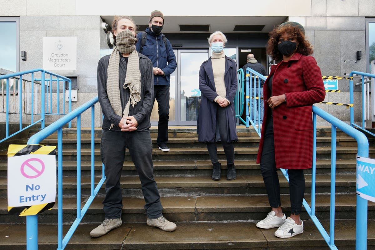 Extinction Rebellion co-founder cleared of one charge over paint-throwing stunt