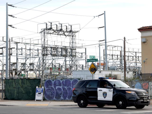 <p>Oakland Police officers block a road near the site of a PG&E substation where a fire earlier in the day caused a power outage throughout much of Oakland, Calif., on Sunday, Feb. 19, 2023. (Carlos Avila Gonzalez/San Francisco Chronicle via AP)</p>