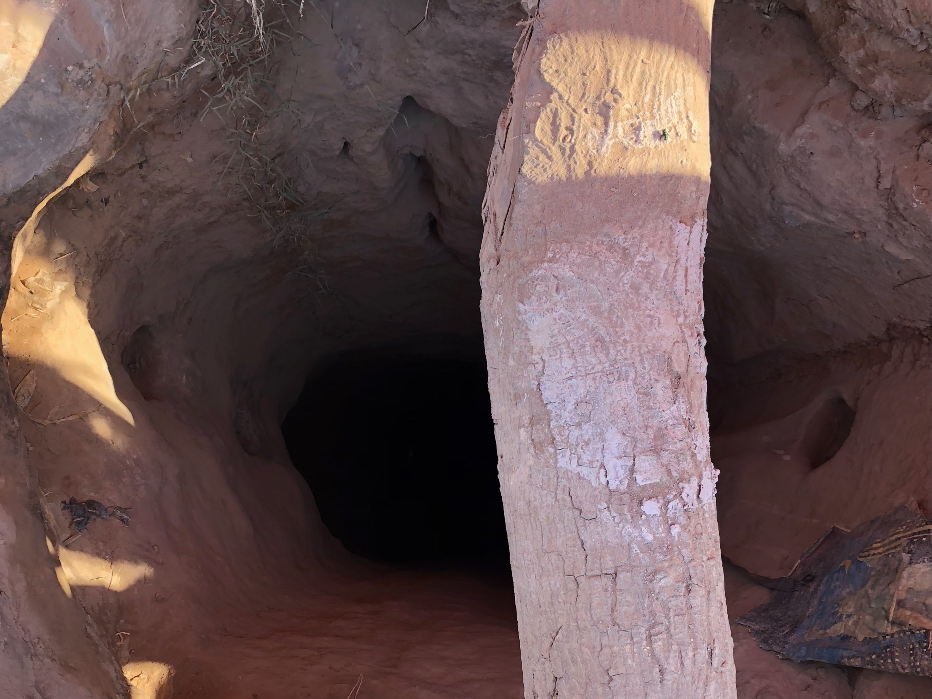 <p>A makeshift tunnel to dig for cobalt in the DRC. It is unclear how many Congolese mine workers have died in tunnel collapses as their deaths are rarely recorded or even acknowledged</p>