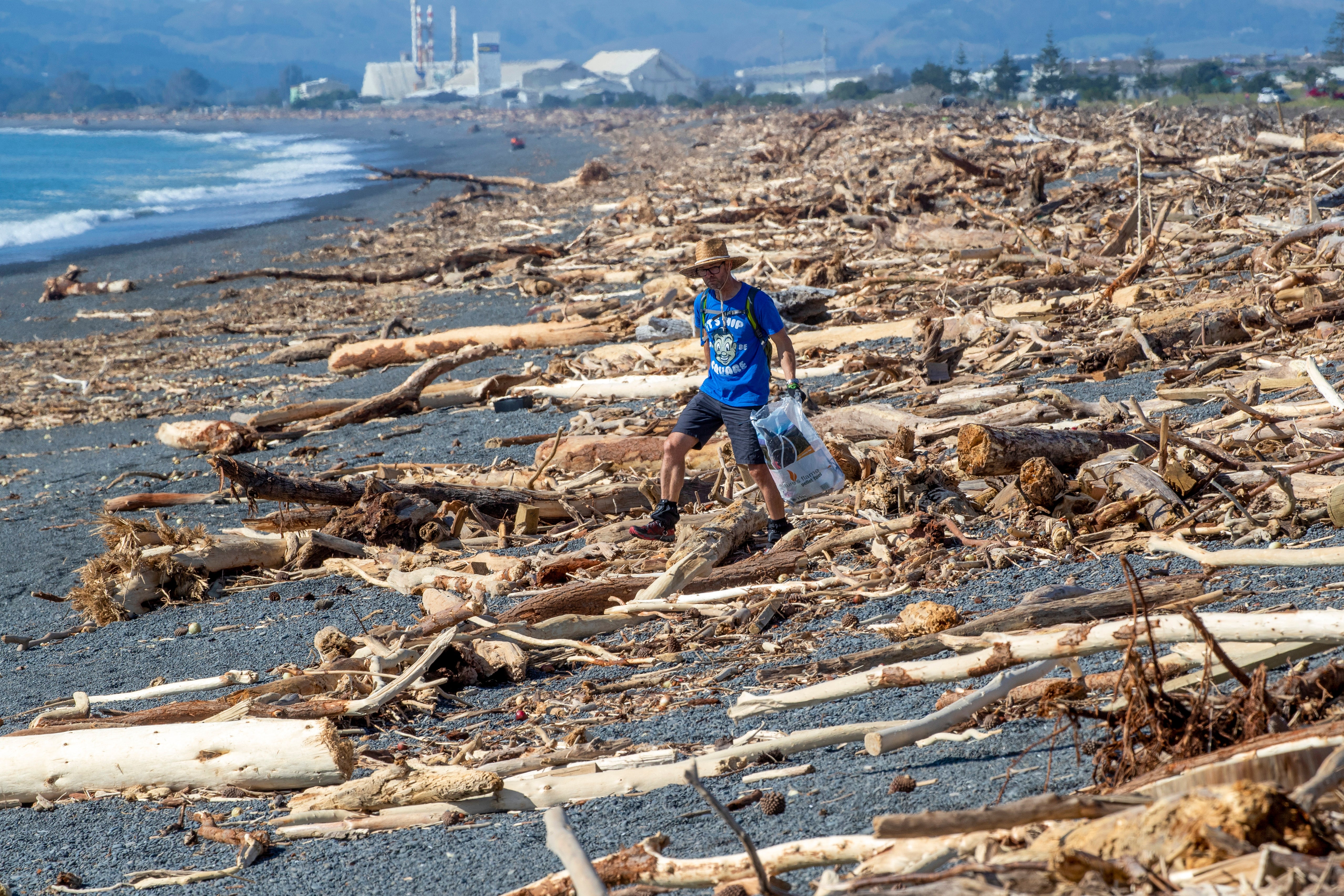 Debris washed up on a beach in New Zealand following the aftermath of Cyclone Gabrielle