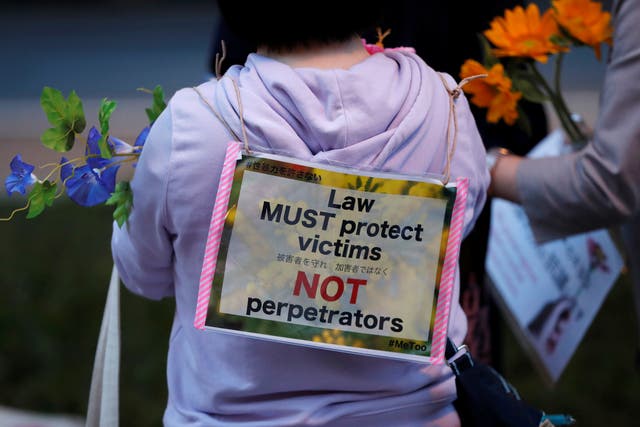 <p>File. Protesters hold fowers at the rally called 'Flower Demo' to criticise acquittals in court cases of alleged rape in Japan in 2019 </p>