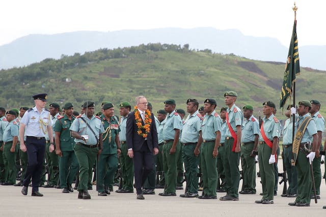 <p>Australia's prime minister Anthony Albanese inspects the guard of honour upon his arrival at Jacksons International Airport in Papua New Guinea's capital Port Moresby on 12 January 2023</p>