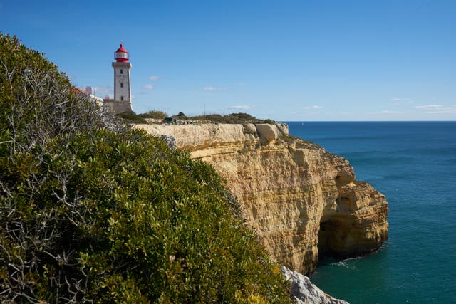 <p>Farol de Alfanzina Lighthouse landscape in Algarve, Portugal</p>