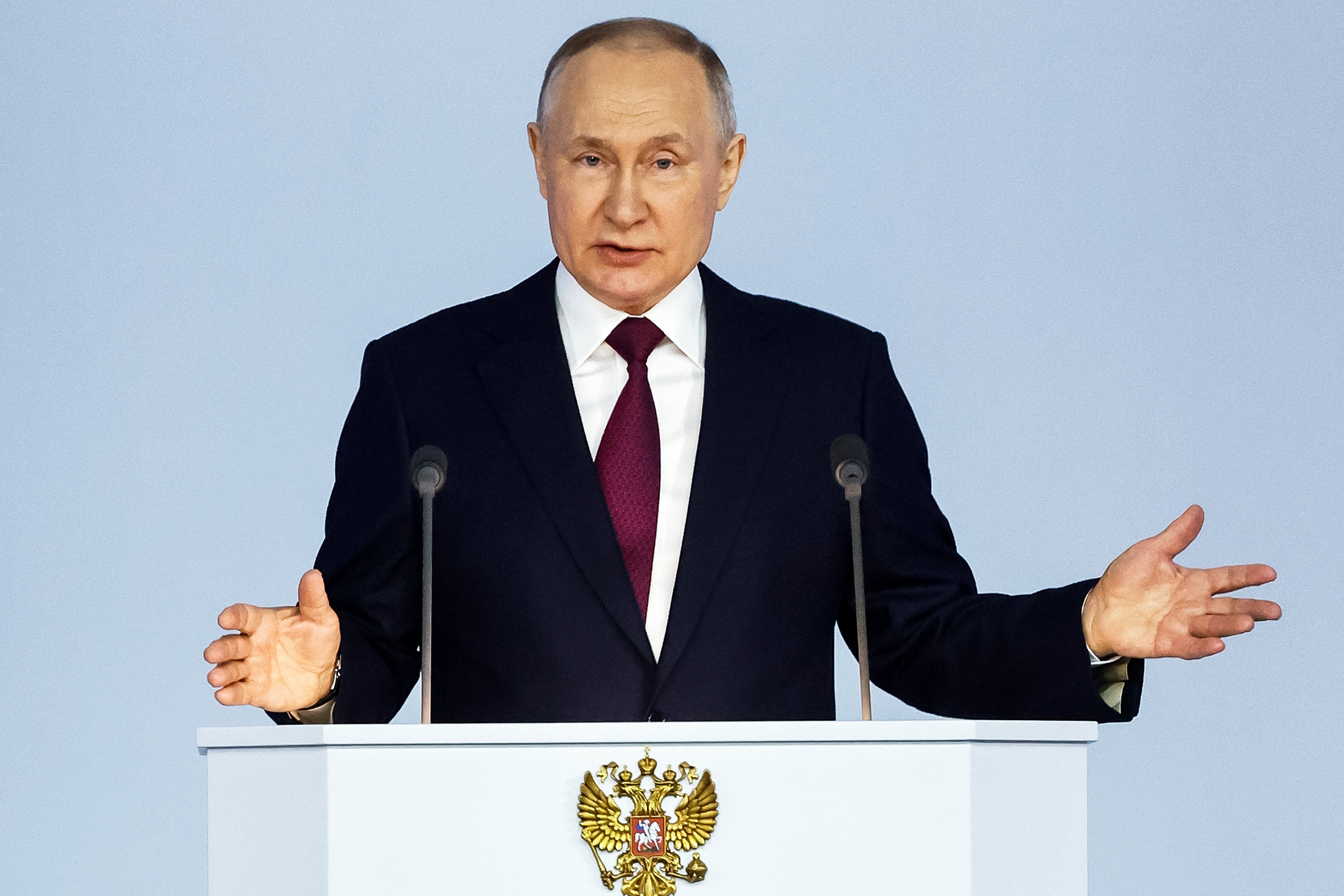 Russian president Vladimir Putin gestures as he gives his annual state of the nation address