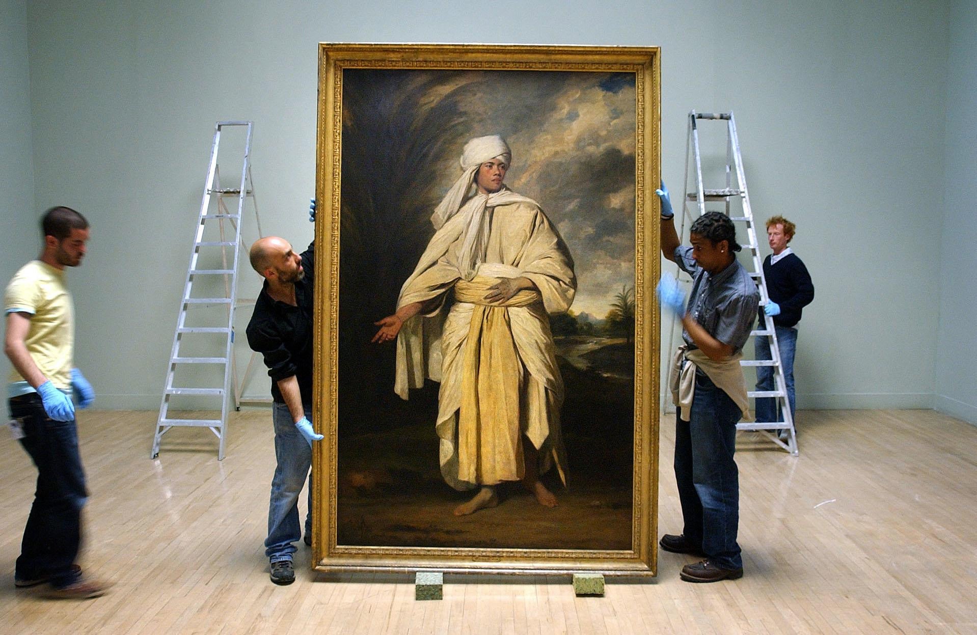 <p>Joshua Reynolds 'Portrait of Omai' is moved before hanging at Tate Britain</p>