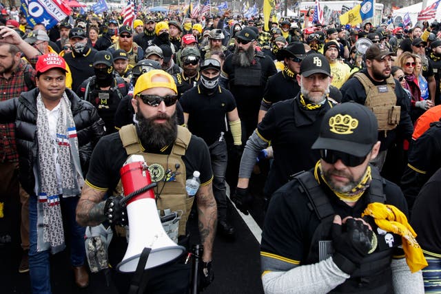 <p>Proud Boys during a December 2020 rally </p>