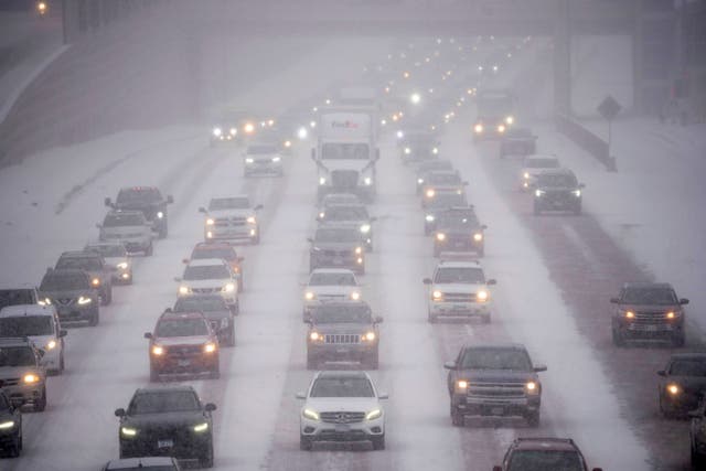 <p>Rush hour traffic on Interstate 35W in Minneapolis as a winter storm hit the Twin Cities on Tuesday</p>
