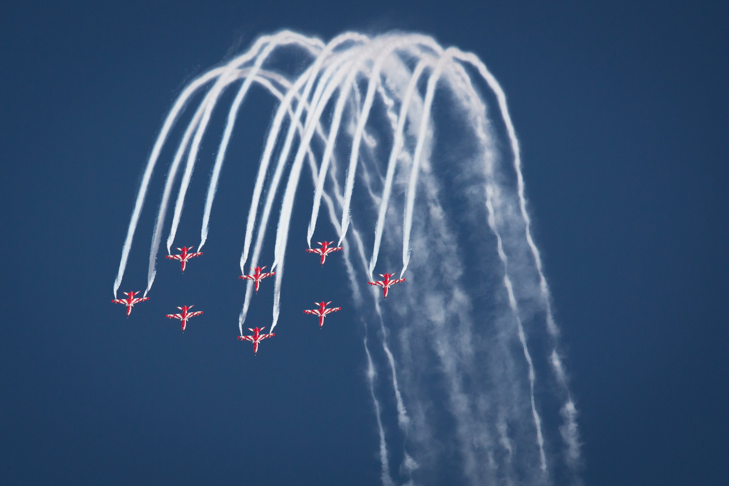 The Surya Kiran Aerobatic Team (SKAT) perform during the inauguration of the Aero India 2023 at the Yelahanka Air Force Station in Bengaluru