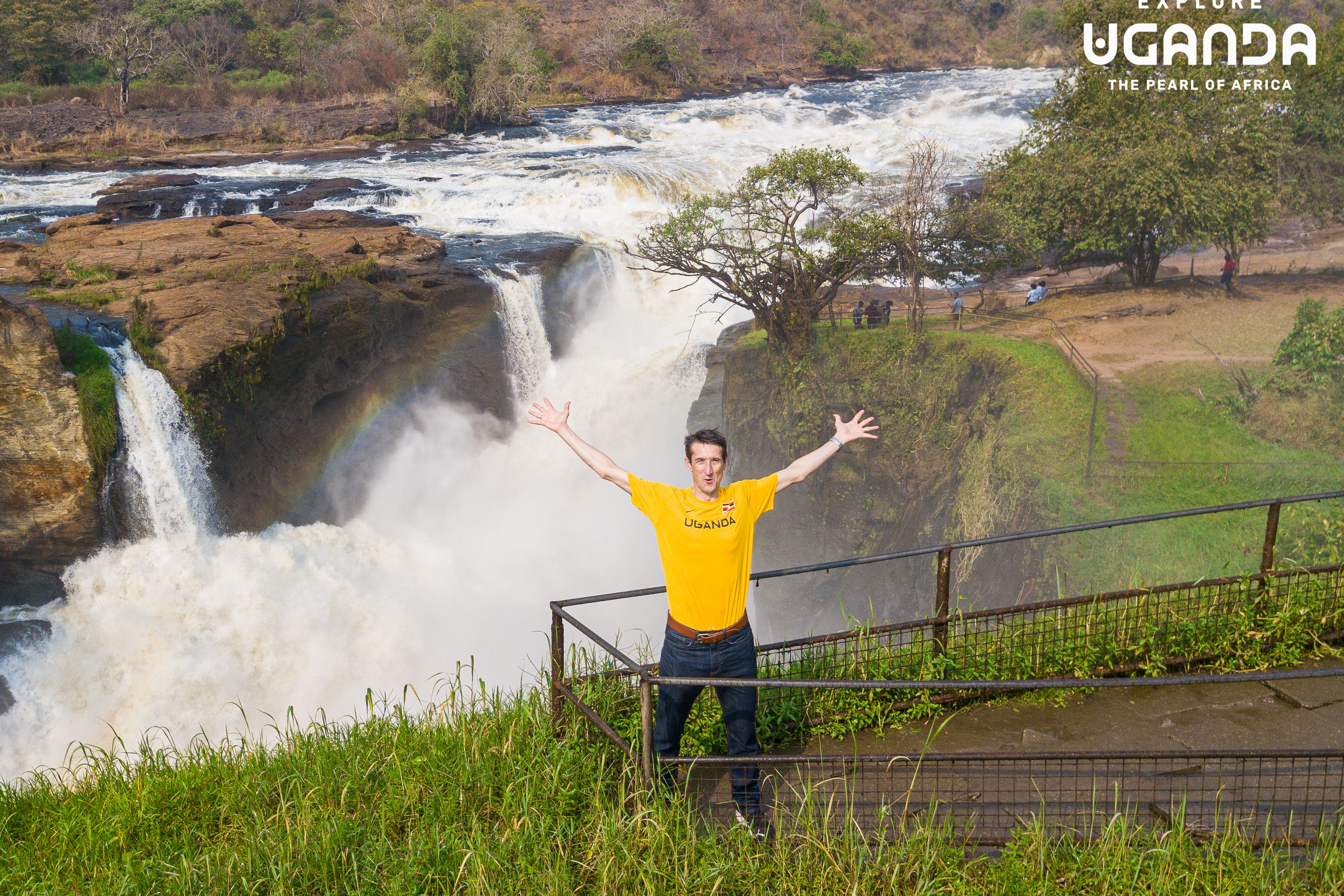 Sports commentator Rob Walker posing in front of Murchison Falls in Uganda (Uganda Tourism Board)