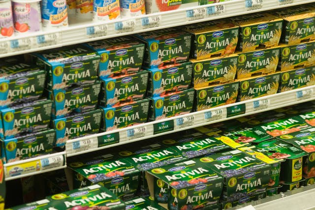 Containers of Danone Activia Yogurt are seen on a supermarket shelf (Alamy/PA)
