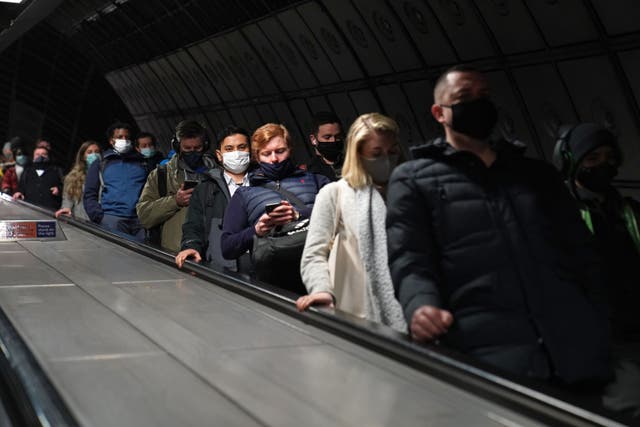 Commuters at Waterloo underground station in London (Stefan Rousseau/PA)