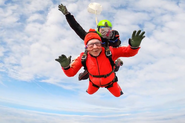 Tom Lowery, 76, completes a skydive, plunging 1,000 feet through the air in memory of his partner (Black Knights Parachute Centre/PA)