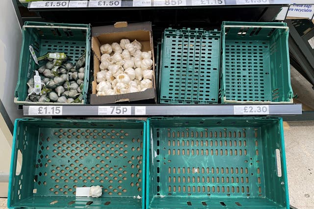 Empty tomato trays at a Tesco Express store in Wimbledon. A shortage of tomatoes affecting UK supermarkets is widening to other fruit and vegetables and is likely to last weeks, retailers have warned. A combination of bad weather and transport problems in Africa and Europe has seen UK supermarket shelves left bare of tomatoes, as well as dwindling stocks of some other fresh produce. Picture date: Tuesday February 21, 2023.