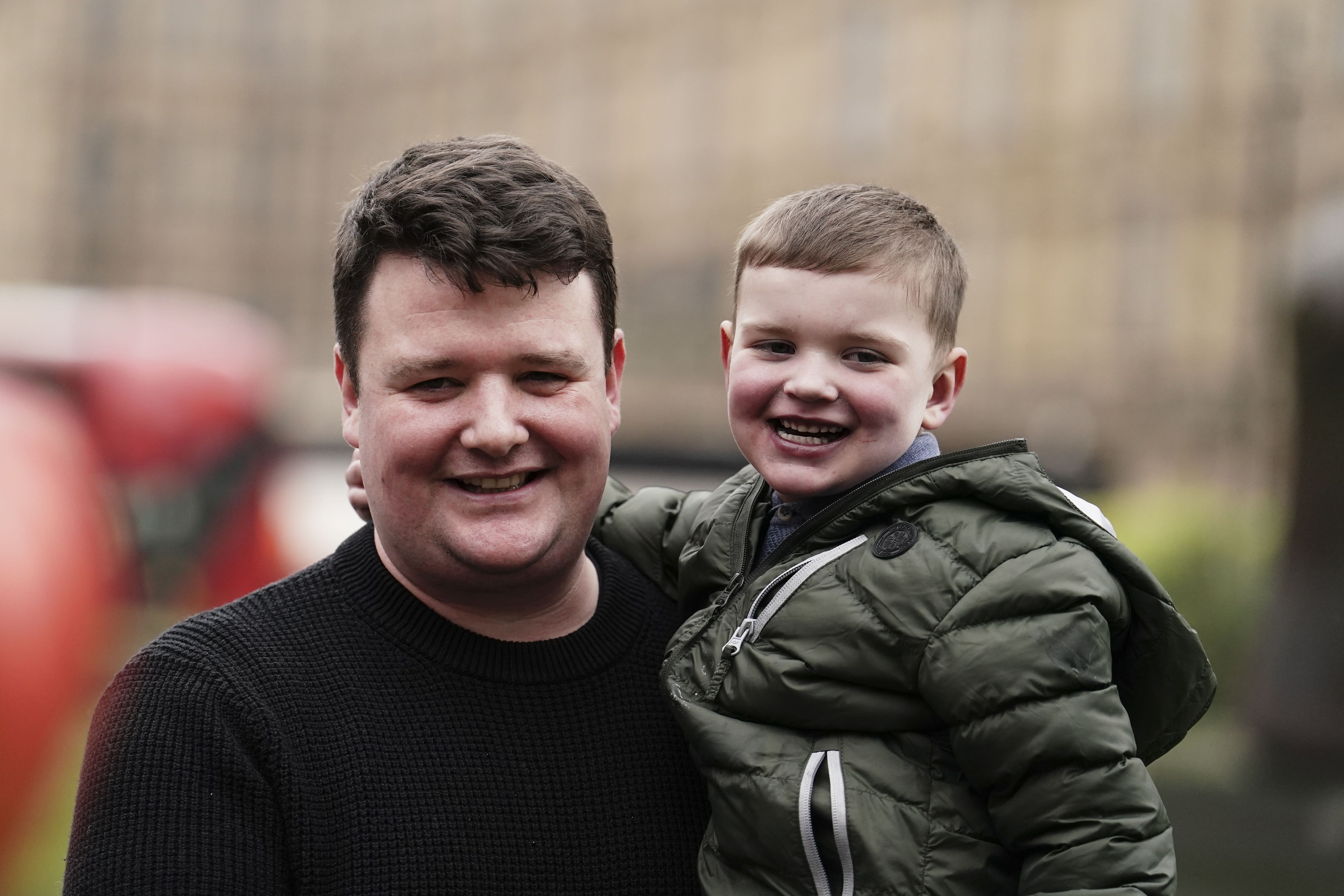 Daithi MacGabhann and his father Mairtin MacGabhann outside the Houses of Parliament in London (Jordan Pettitt/PA)