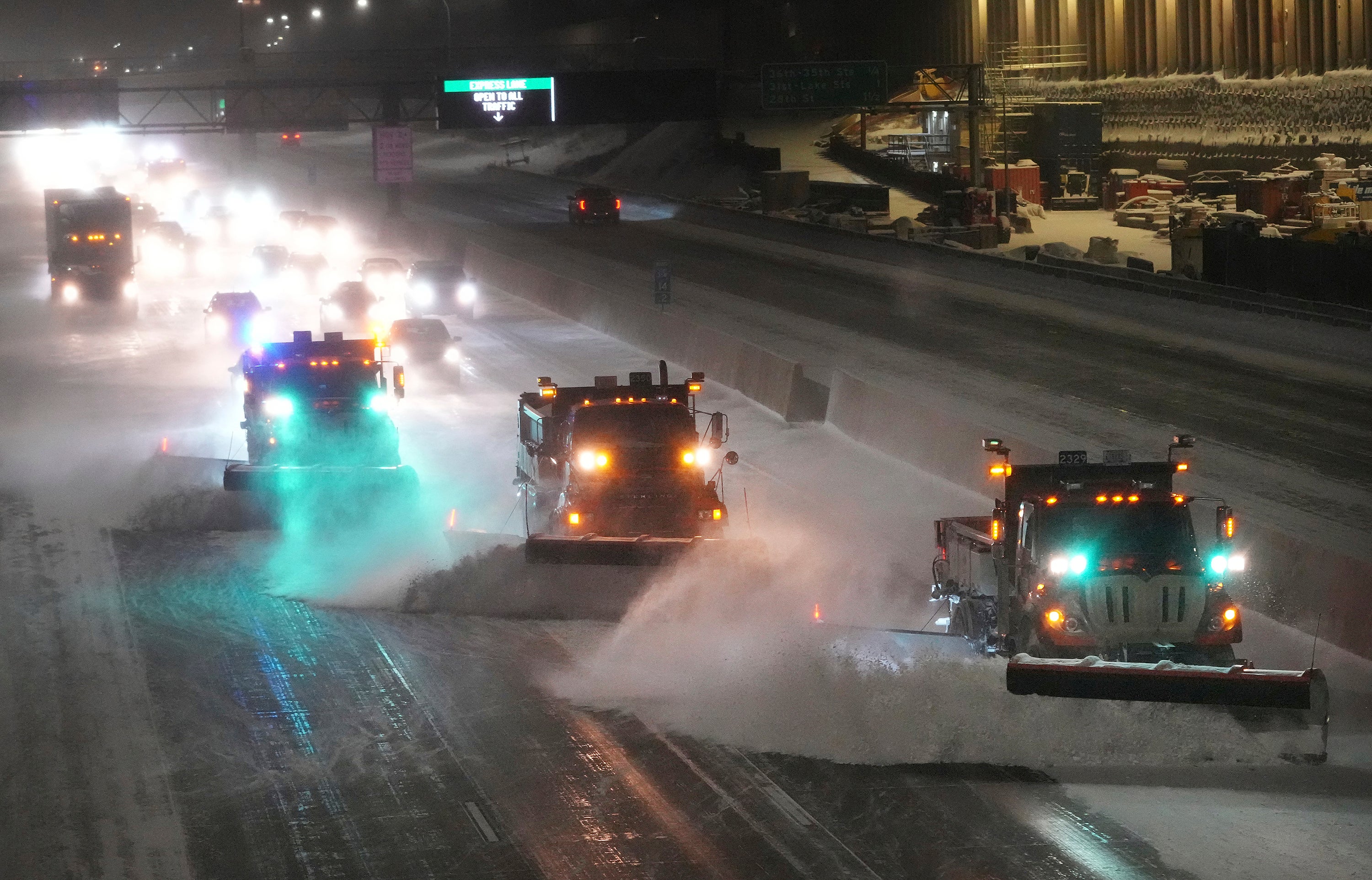 Snow plows hit the interstate highway I-35 as Minnesota prepares for a winter storm, early on Wednesday, in Minneapolis. Brutal winter weather bringing snow, dangerous gusts of wind and bitter cold settled over much of the northern US on Wednesday (David Joles/Star Tribune via AP)