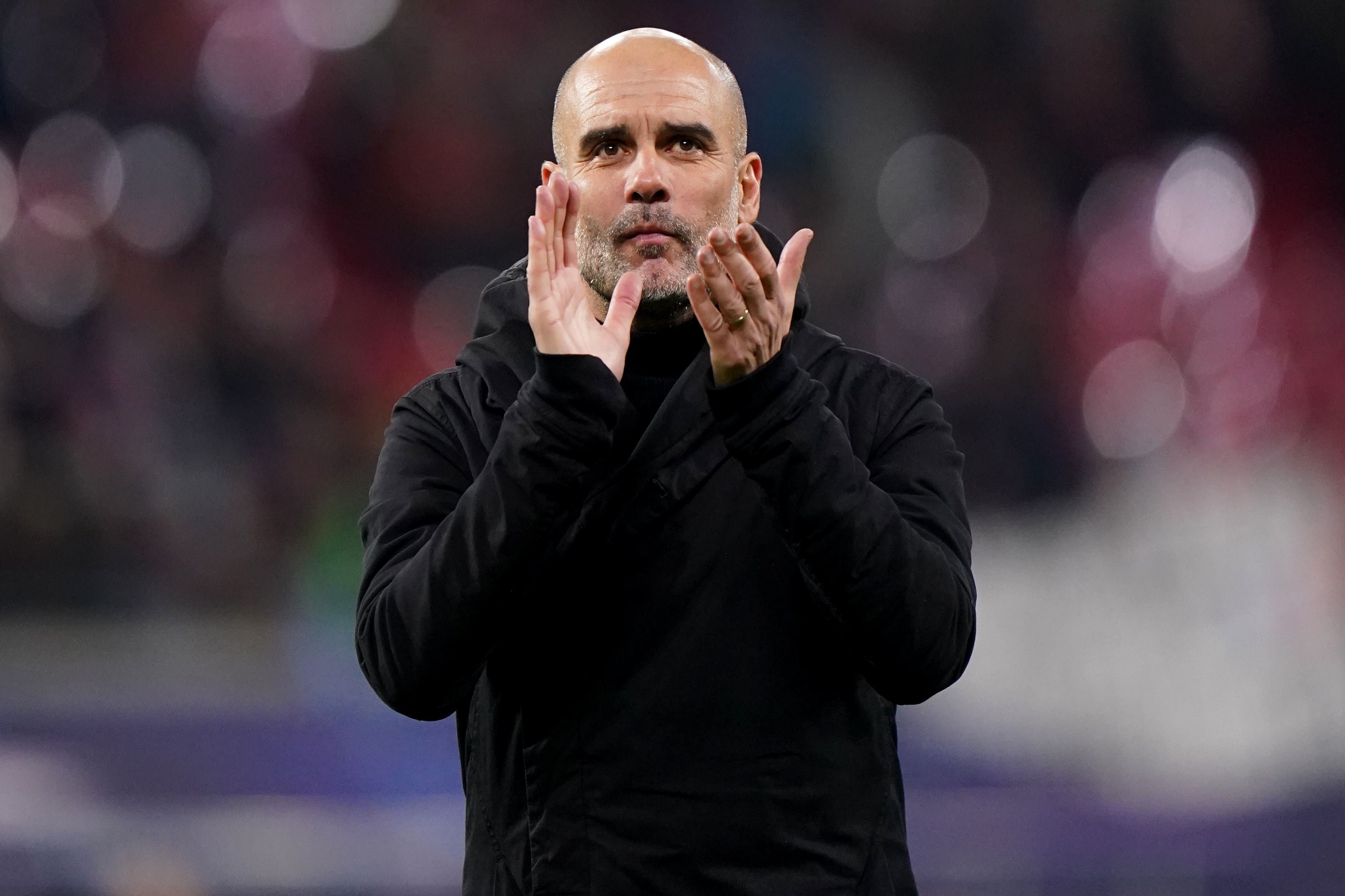 Manchester City manager Pep Guardiola applauds the fans after the Champions League draw at RB Leipzig (Tim Goode/PA)
