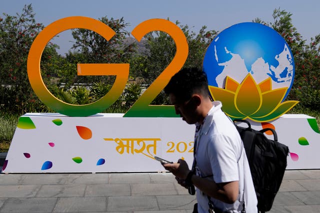 <p>A man walks past G-20 signage at the venue of the G-20 financial conclave on the outskirts of Bengaluru</p>