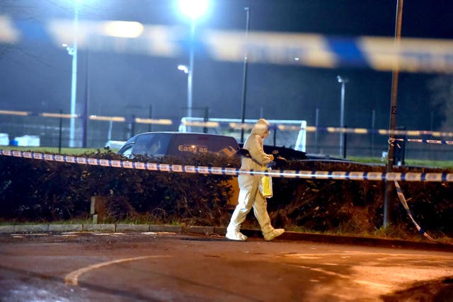 <p>A forensics officer at the scene of a shooting in the Killyclogher Road area of Omagh (PA)</p>