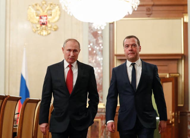 <p>File: Russian president Vladimir Putin and deputy chair of the security council of the Russian federation Dmitry Medvedev walk before a meeting with members of the government in Moscow </p>