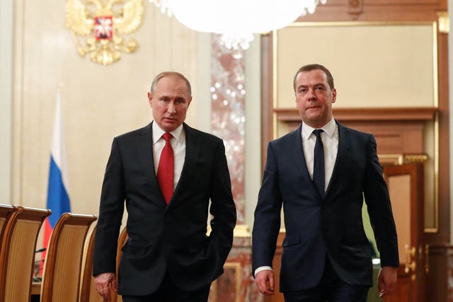 <p>File: Russian president Vladimir Putin and deputy chair of the security council of the Russian federation Dmitry Medvedev walk before a meeting with members of the government in Moscow </p>