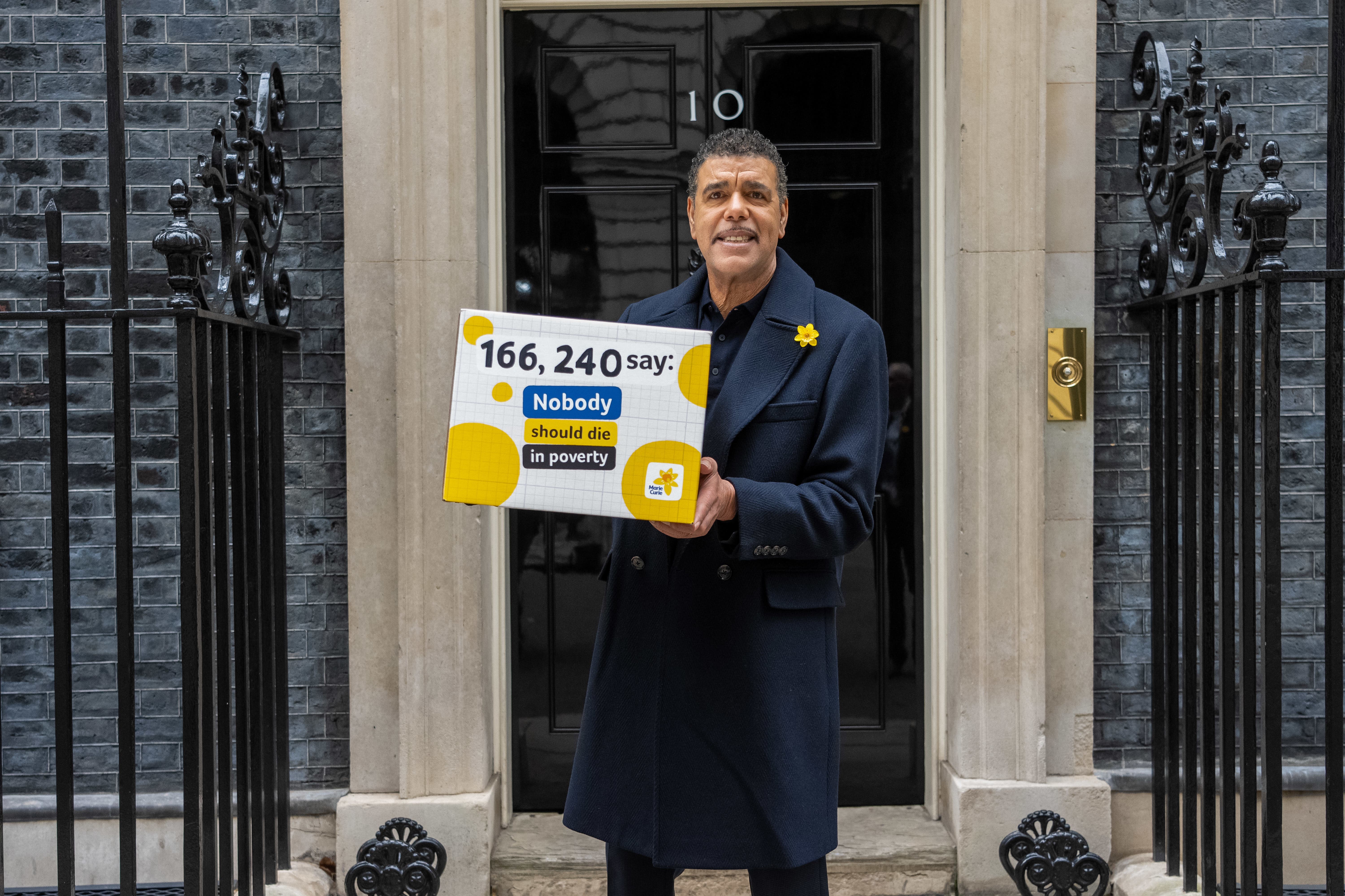 TV presenter and football pundit Chris Kamara, pictured, delivering a petition to Downing Street. (Jeff Moore/PA)