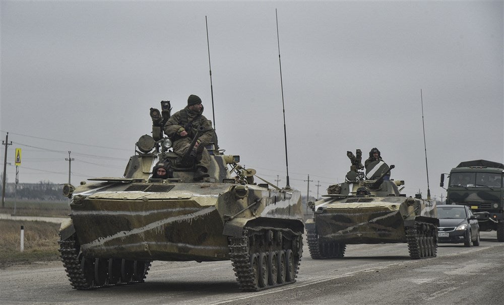 Russian soldiers move towards mainland Ukraine on the road near Armiansk, Crimea