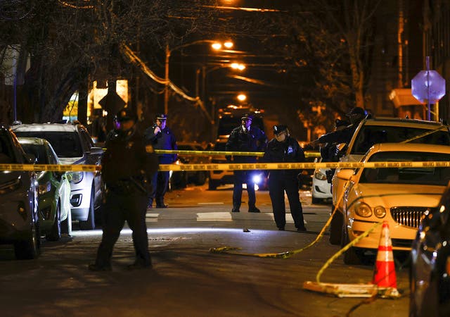 <p>File Philadelphia police officers investigate the fatal shooting of a Temple University police officer near the campus on 18 Feb</p>