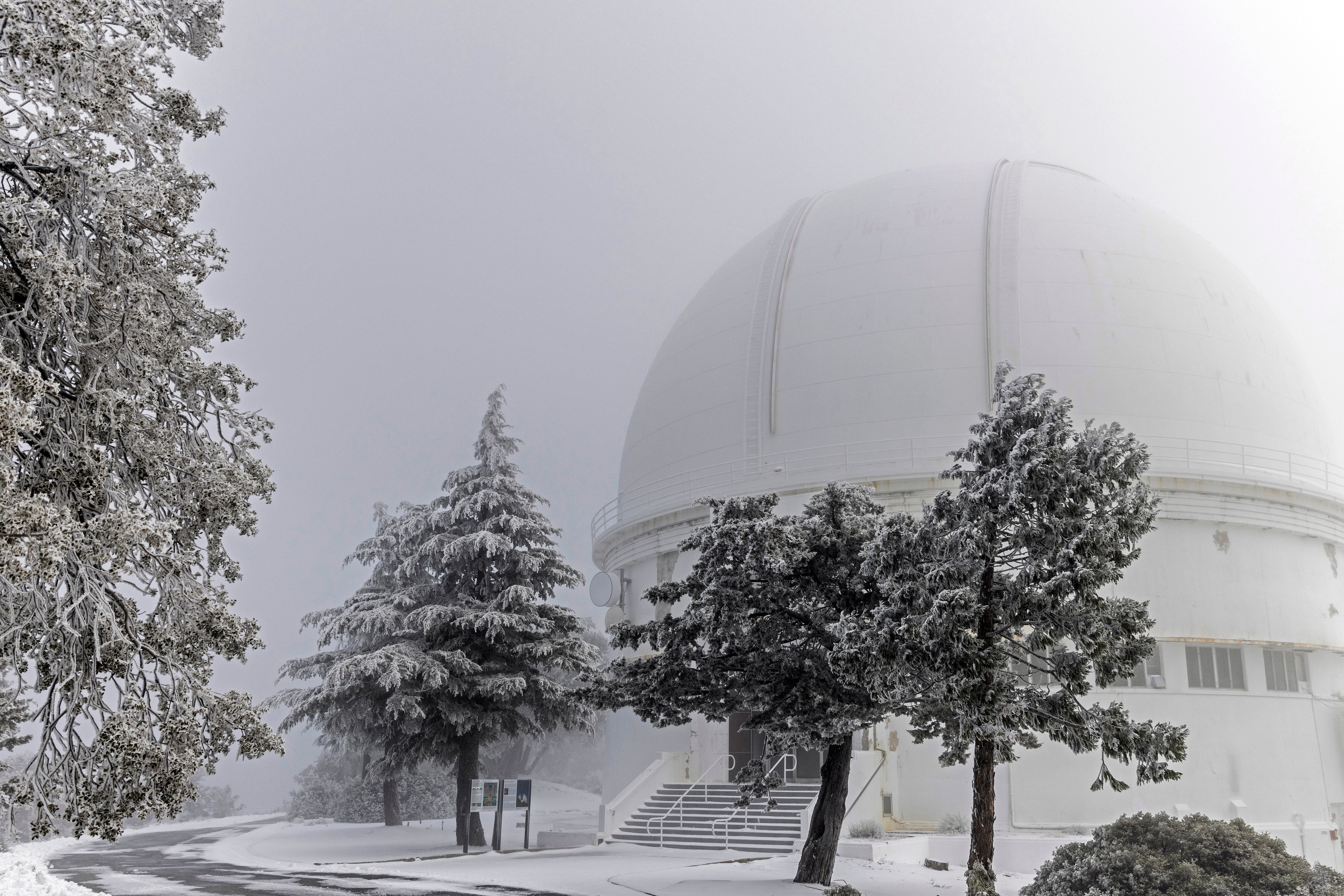 A layer of snow and ice is seen outside the 120-inch telescope observation tower at Lick Observatory in Mount Hamilton, California, on Thursday 23 February 2023