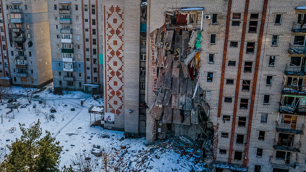 his aerial photograph shows a damaged residential building in the town of Lyman, Donetsk