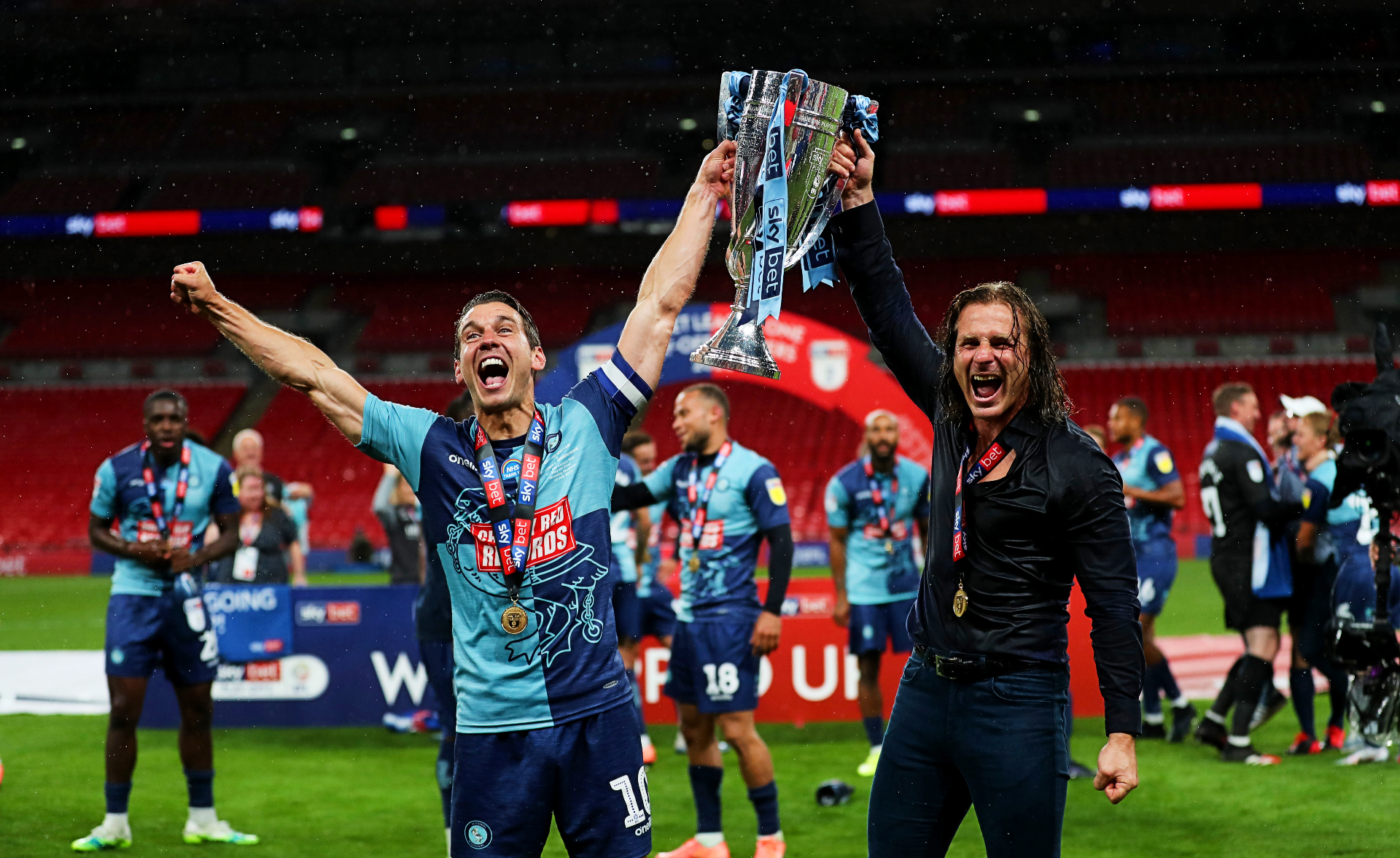 Matt Bloomfield and Gareth Ainsworth celebrate Wycombe’s historic promotion to the Championship in 2020