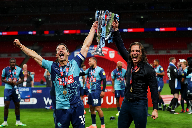 <p>Matt Bloomfield and Gareth Ainsworth celebrate Wycombe’s historic promotion to the Championship in 2020 </p>
