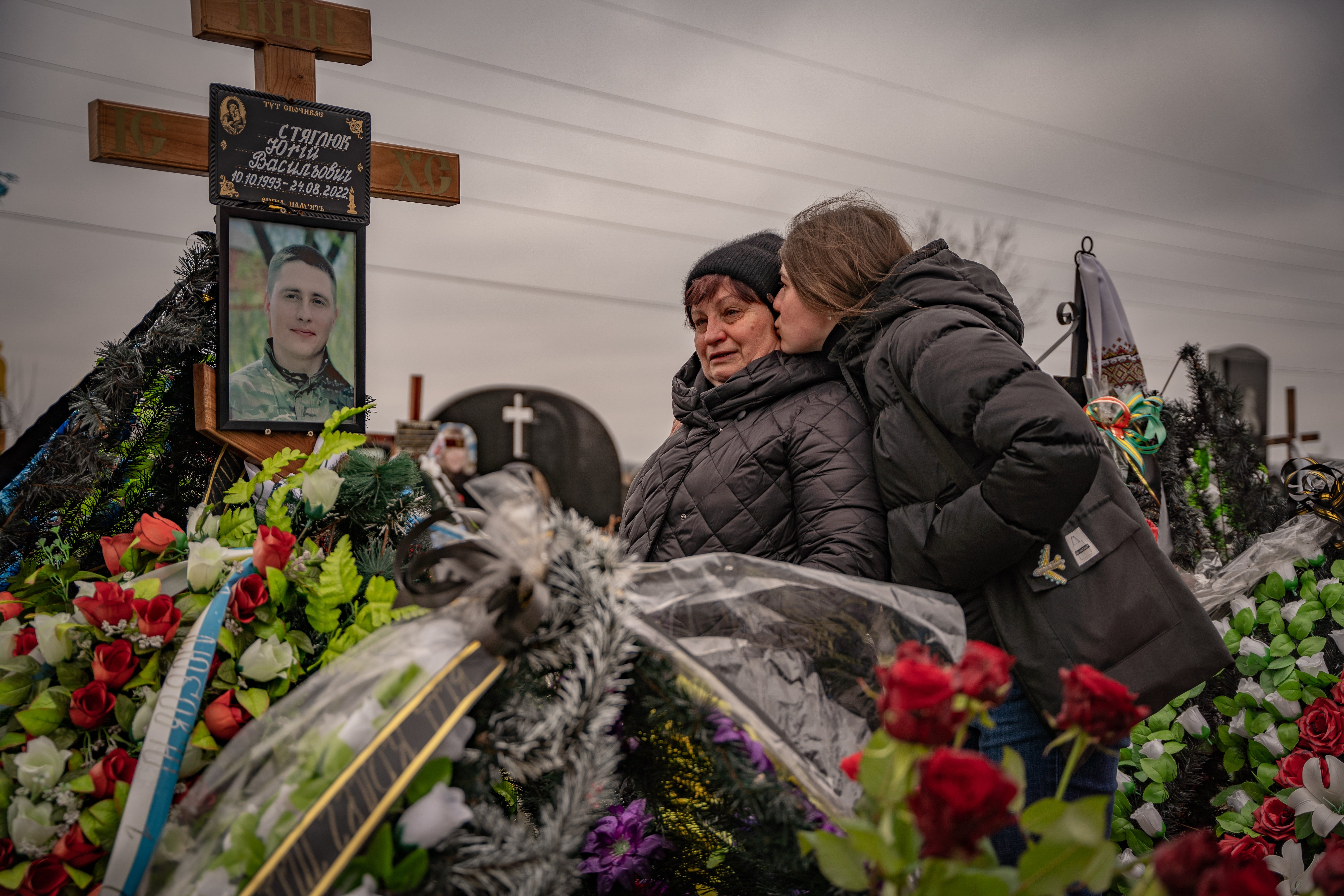 Residents of Bucha mourn their dead on the anniversary of Russia’s invasion of the country